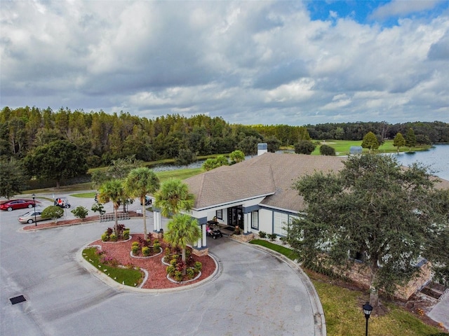 birds eye view of property with a water view