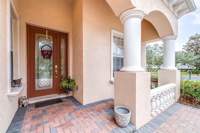 entrance to property with a porch