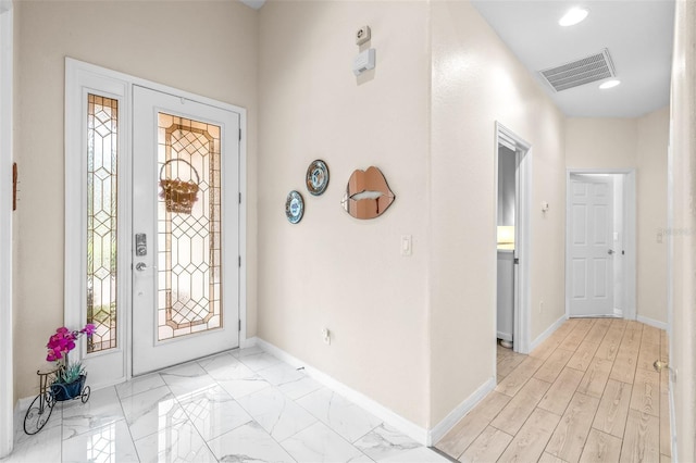 foyer with plenty of natural light