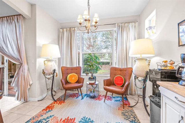 sitting room featuring light tile patterned flooring and an inviting chandelier