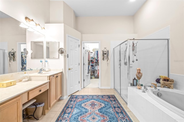 bathroom featuring vanity, tile patterned flooring, and plus walk in shower