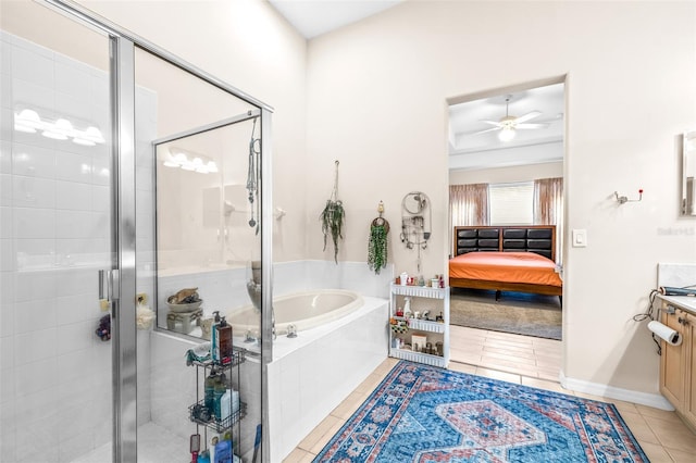 bathroom featuring ceiling fan, tile patterned flooring, separate shower and tub, and vanity