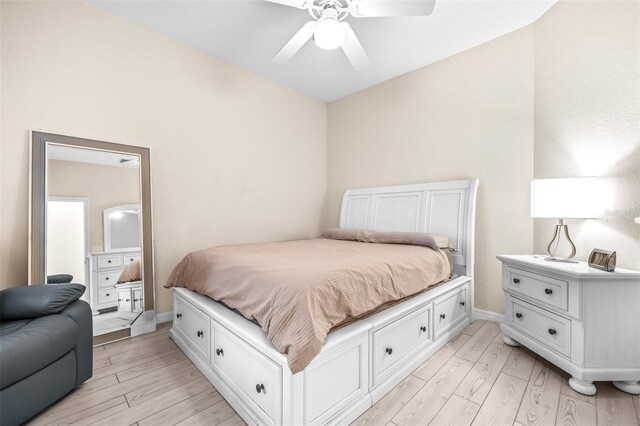 bedroom with ceiling fan and light hardwood / wood-style floors