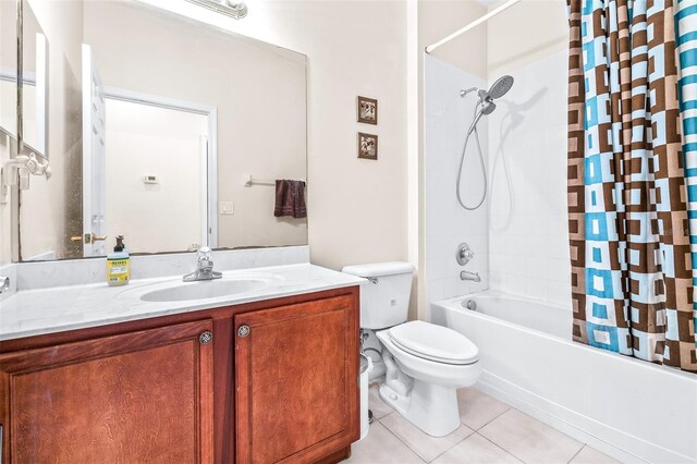 full bathroom with toilet, shower / bathtub combination with curtain, tile patterned floors, and vanity