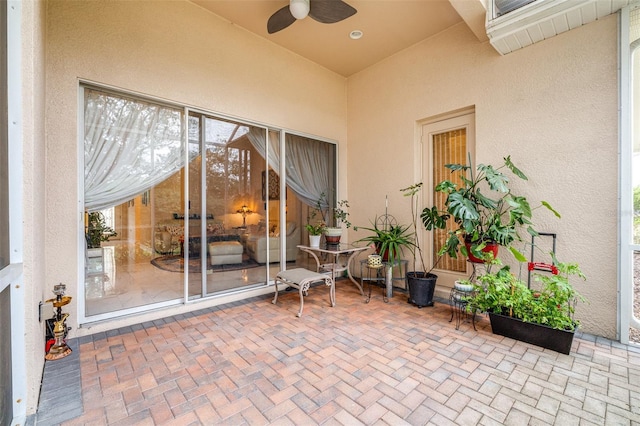 exterior space featuring ceiling fan