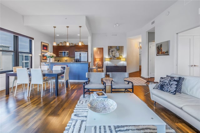 living room with dark hardwood / wood-style floors