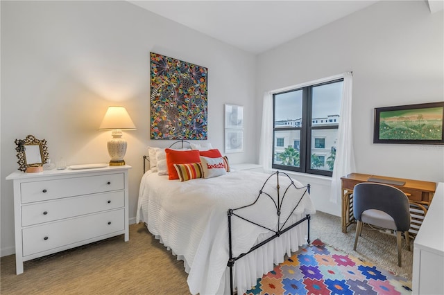 bedroom featuring light colored carpet