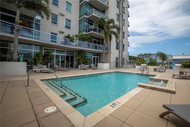 view of pool featuring a patio