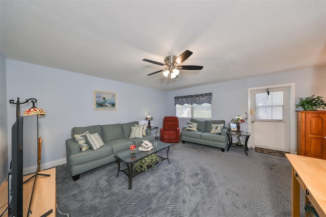 carpeted living room featuring ceiling fan and a wealth of natural light