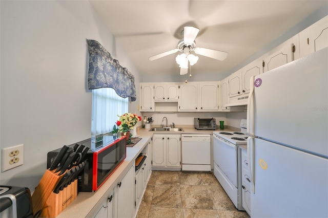 kitchen with white appliances, white cabinetry, and sink