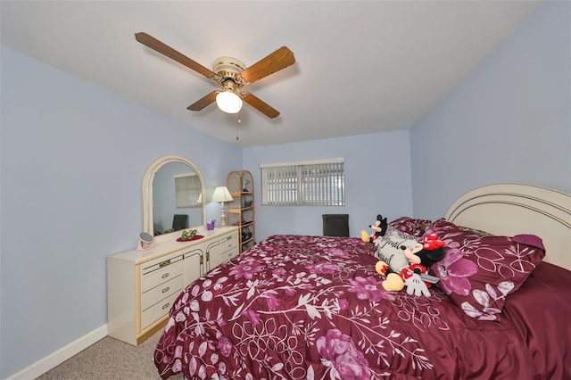 bedroom with ceiling fan and light carpet