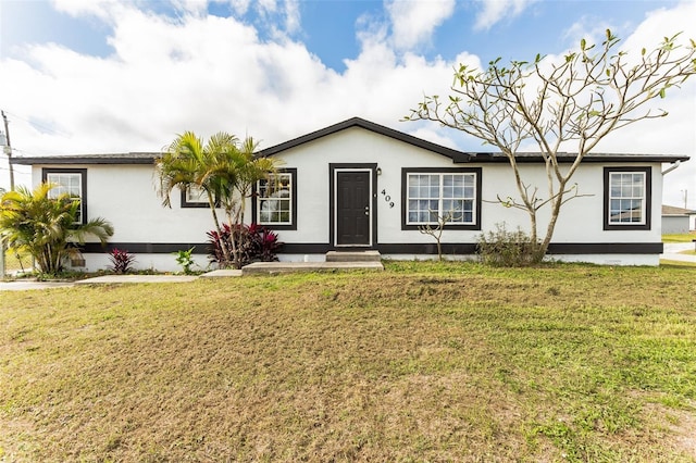 ranch-style home with a front yard