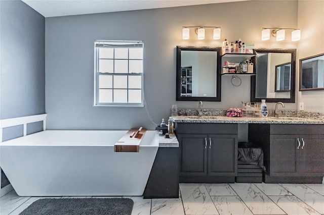 bathroom featuring vanity, a bathtub, and vaulted ceiling