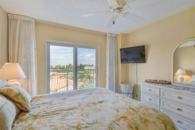 bedroom featuring a textured ceiling, ceiling fan, and access to exterior