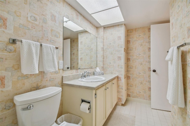 bathroom with toilet and vanity