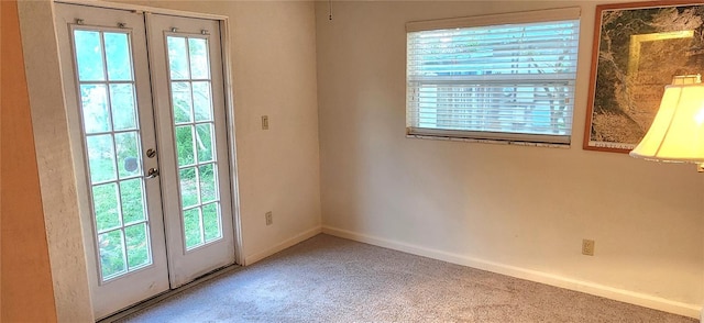 doorway to outside with carpet flooring and french doors