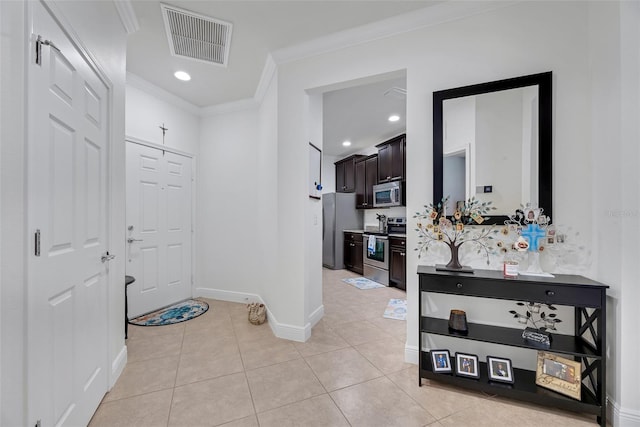 hallway featuring light tile patterned flooring and crown molding