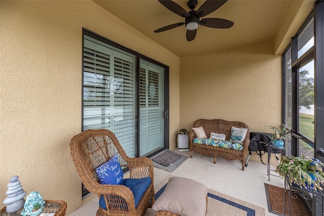 sunroom / solarium with ceiling fan