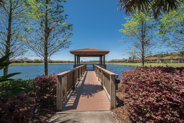 dock area with a water view and a gazebo