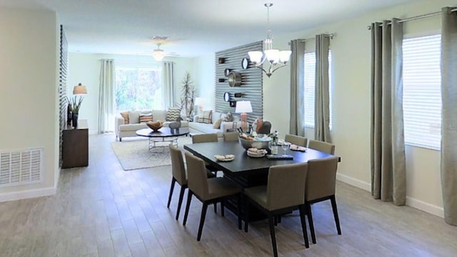 dining area featuring hardwood / wood-style floors and a wealth of natural light