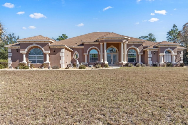 mediterranean / spanish-style home featuring a front lawn