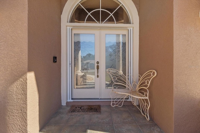 entrance to property featuring french doors