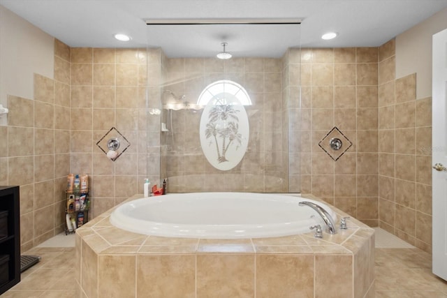 bathroom featuring tile walls and separate shower and tub