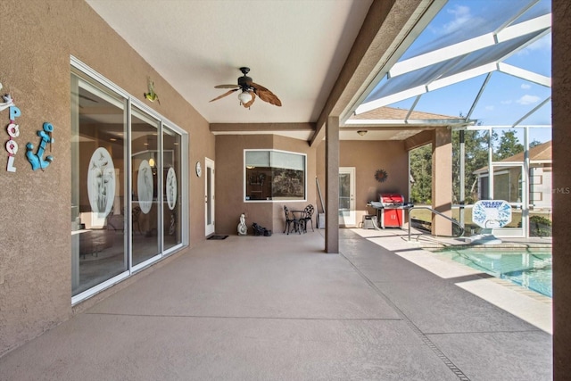 view of patio / terrace with a lanai, grilling area, and ceiling fan