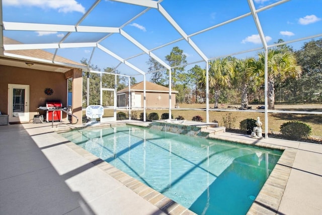 view of pool with a lanai, a patio, and area for grilling