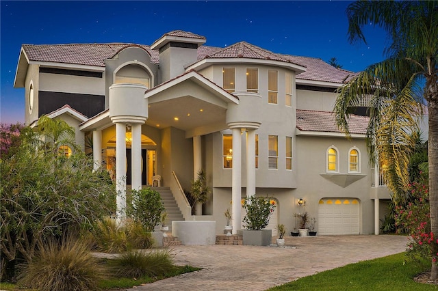 mediterranean / spanish-style home featuring a garage