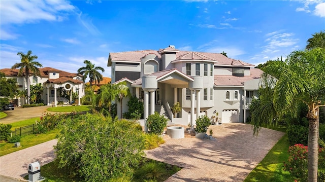 mediterranean / spanish-style home featuring a garage