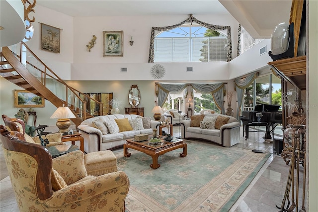 living room with a towering ceiling