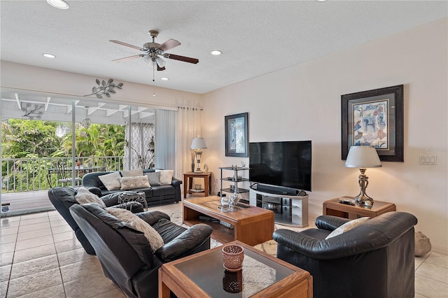 tiled living room featuring a textured ceiling and ceiling fan