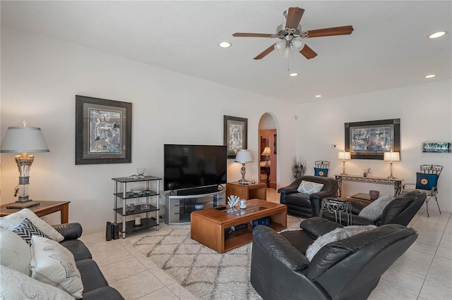 tiled living room with ceiling fan