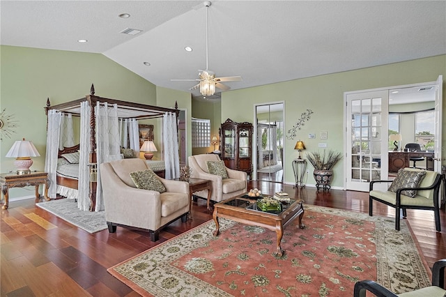 living room with ceiling fan, dark hardwood / wood-style floors, and lofted ceiling