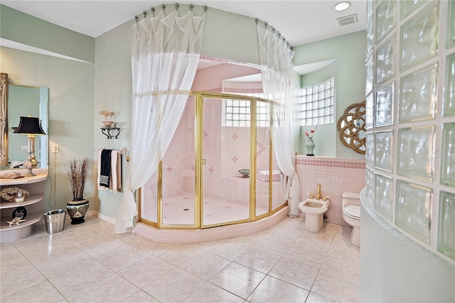 bathroom with a bidet, toilet, walk in shower, and tile patterned flooring