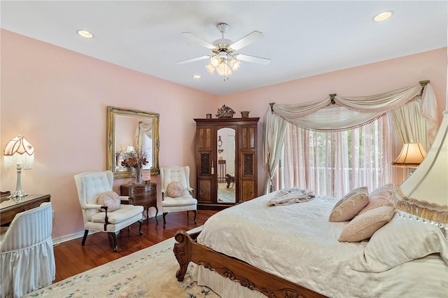 bedroom with dark wood-type flooring and ceiling fan