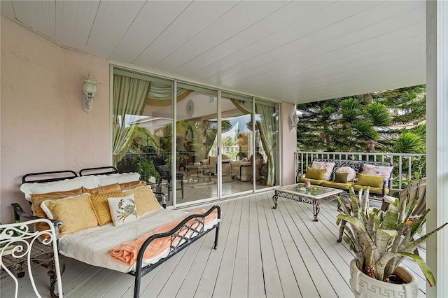 wooden terrace with outdoor lounge area