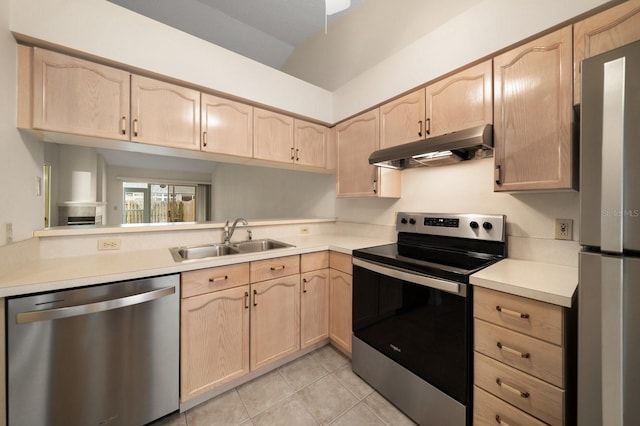 kitchen with stainless steel appliances, light tile patterned floors, sink, and light brown cabinetry