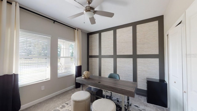 carpeted office with ceiling fan