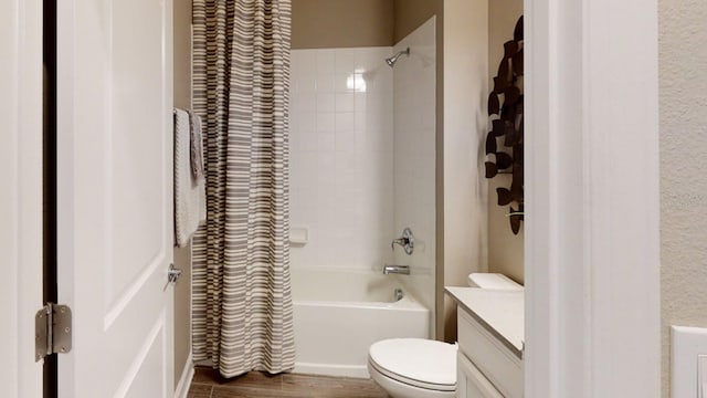 full bathroom featuring toilet, shower / tub combo, vanity, and hardwood / wood-style floors