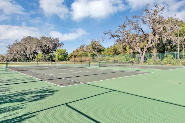 view of tennis court with basketball court