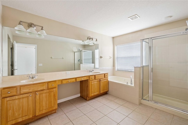 bathroom featuring tile patterned floors, independent shower and bath, and vanity