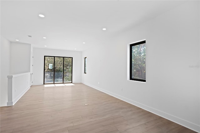 spare room featuring light hardwood / wood-style flooring