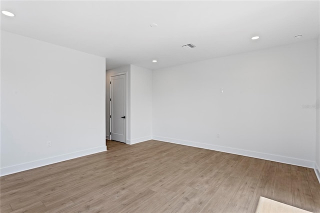 unfurnished room with light hardwood / wood-style floors