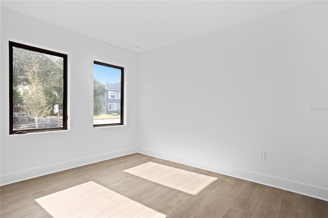 unfurnished room featuring light hardwood / wood-style floors