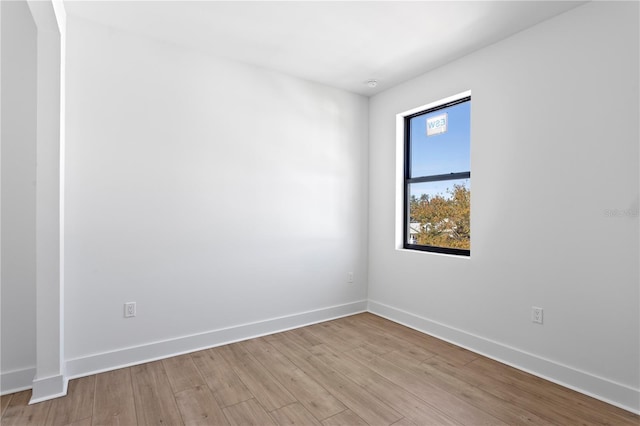 spare room featuring light hardwood / wood-style flooring