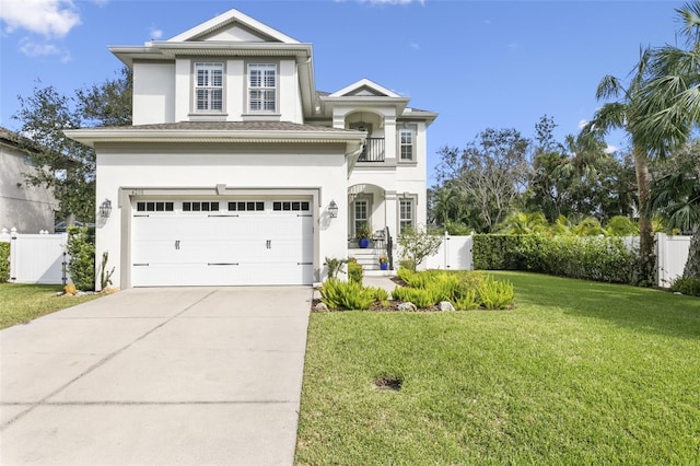 view of front of home featuring a front yard and a garage