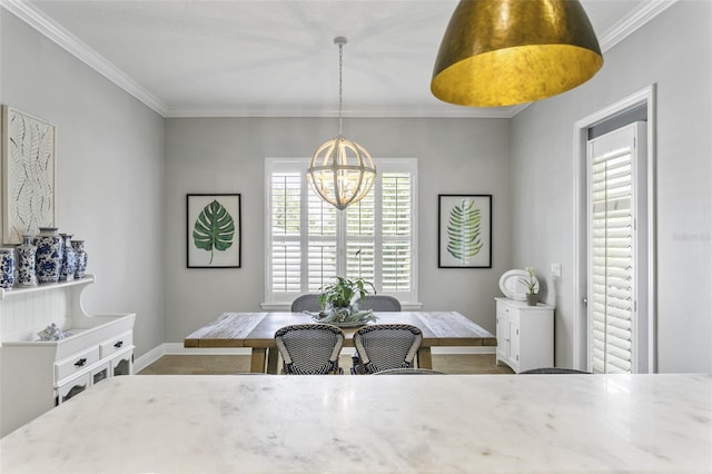 dining area featuring crown molding and a chandelier