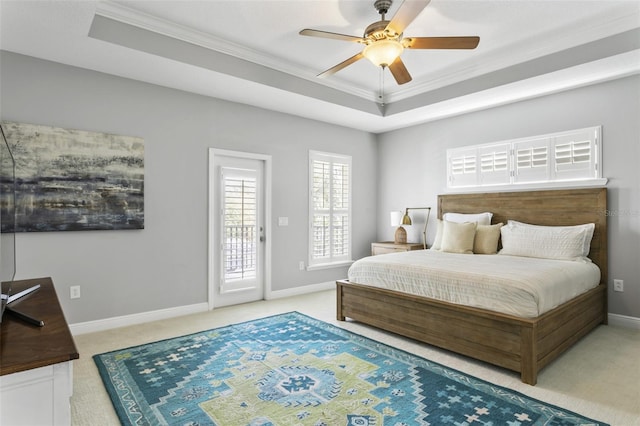 carpeted bedroom featuring a raised ceiling, access to outside, ornamental molding, and ceiling fan